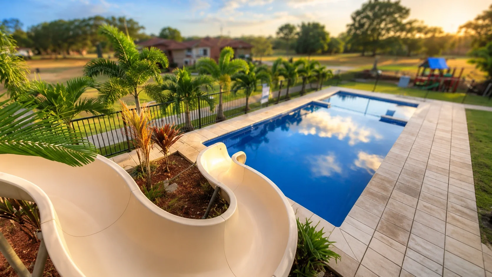 The approved AquaSplash backyard pool and slide photograph